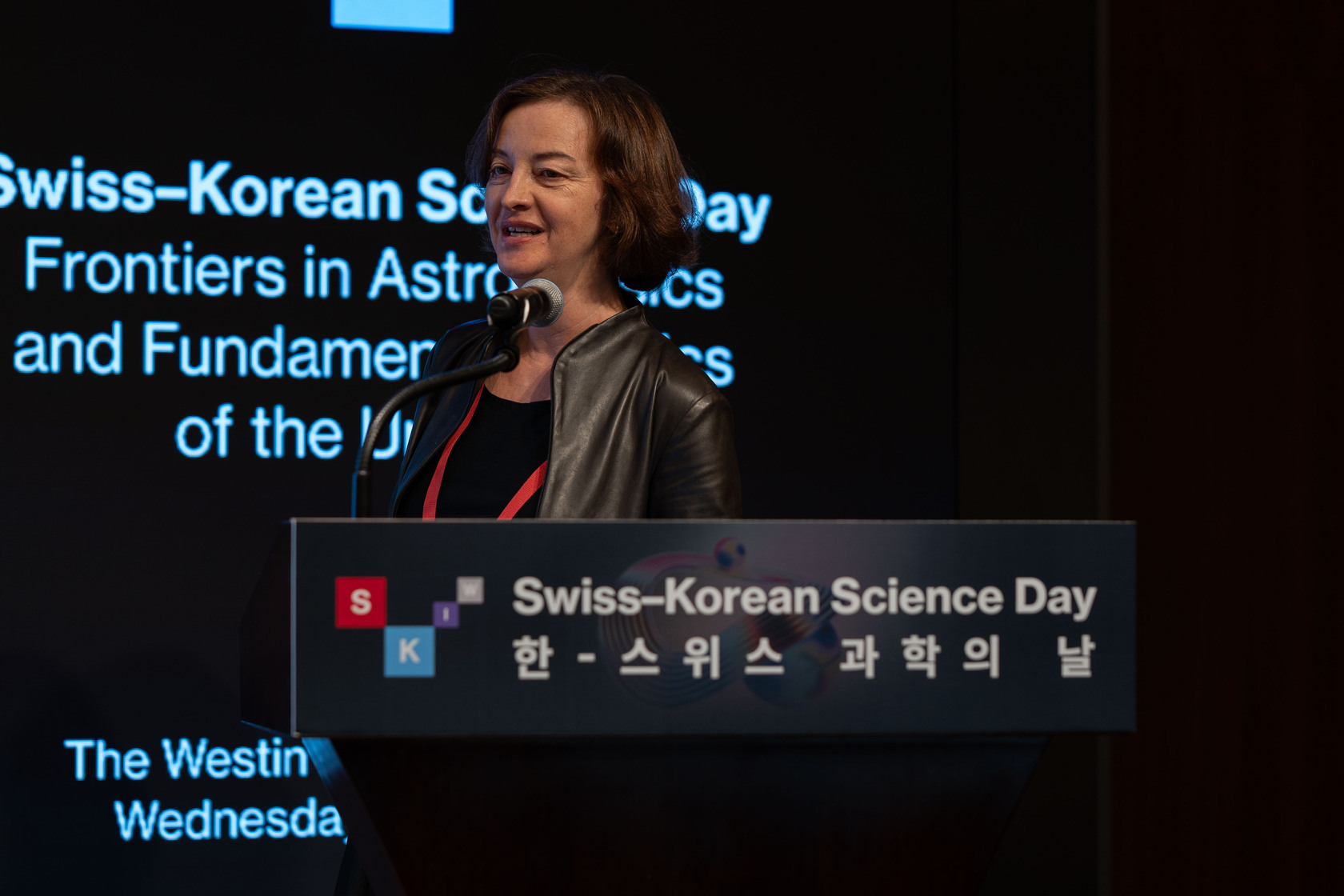 Prof. Laura Baudis, Professor of Experimental Physics, presenting “Searching for Dark Matter in the Milky Way: Where Are We and Where Are We Going?” during SKIW Science Day.